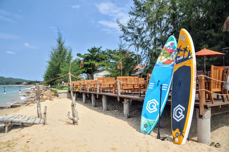 Full view of elevated wooden dining deck from the beach