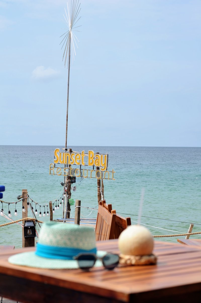 Guest POV: hat and sunglasses on table