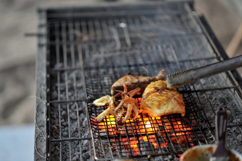 Squid grilling on charcoal